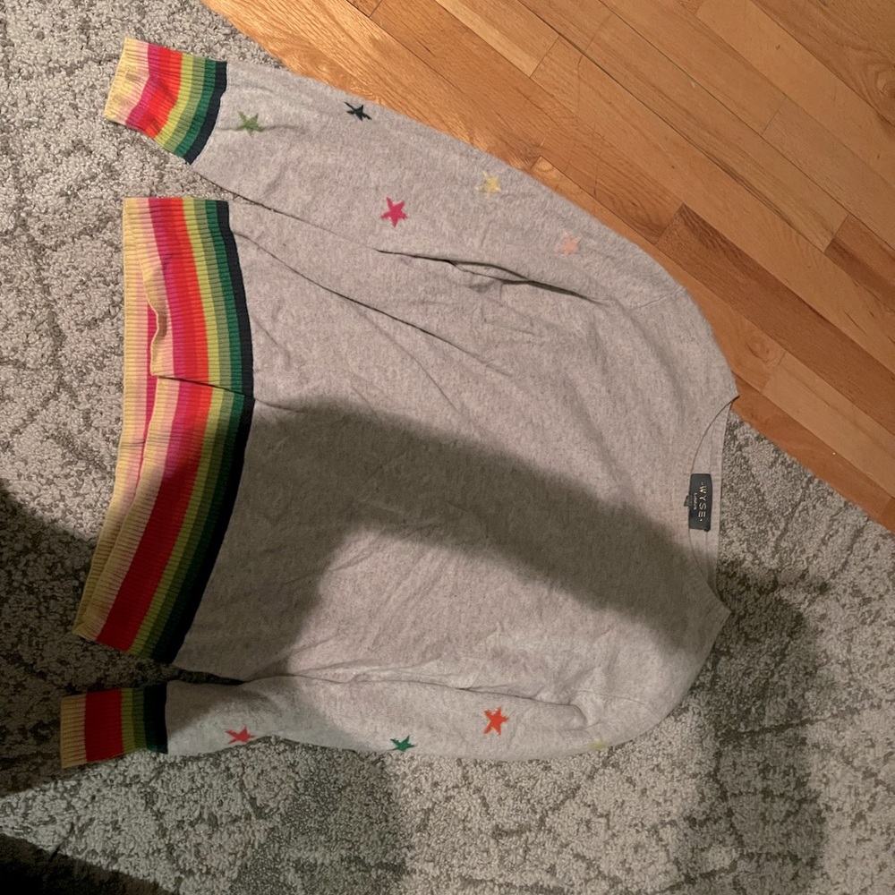 Casere Wyze sweater with rainbow trim. Size 2- equivalent to a medium